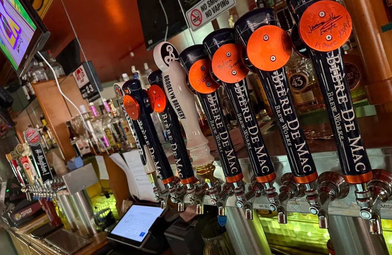Beer taps and bar counter inside Torch Bar & Grill