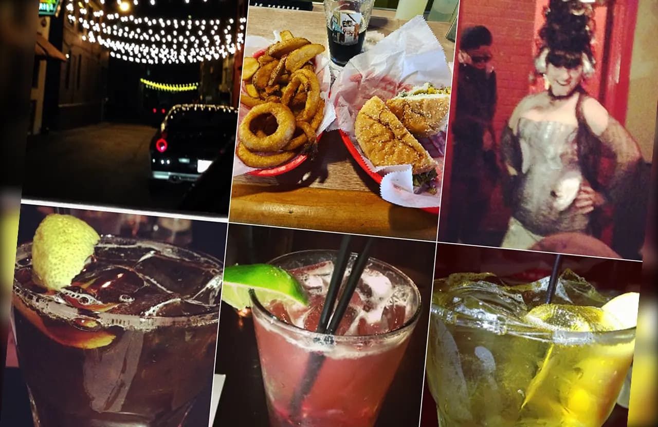 Assorted cocktails and food plates on a Torch Bar table
