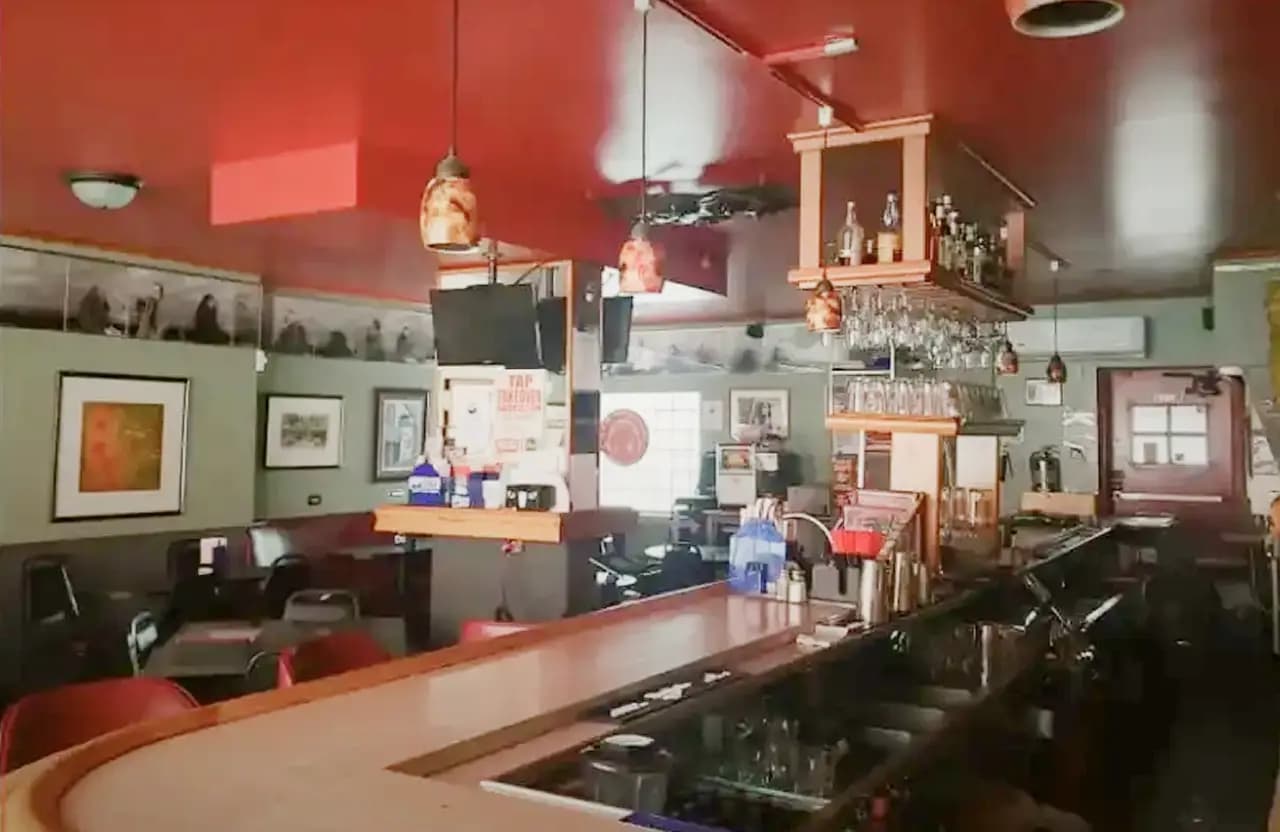Interior view of Torch Bar with framed photos on the walls